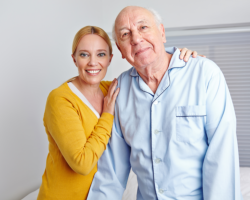 a lady and an old man smiling